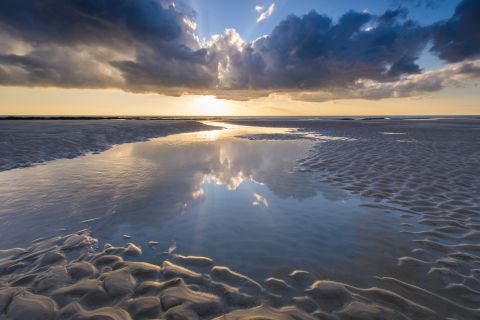 Zonondergang oip het strand van Ambleteuse